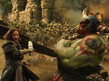 Travis Fimmel (L) stars in "Warcraft."
