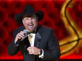 In this Dec. 2, 2015 file photo, Garth Brooks performs during the Sinatra 100 - An All-Star Grammy Concert at The Wynn Las Vegas in Las Vegas.