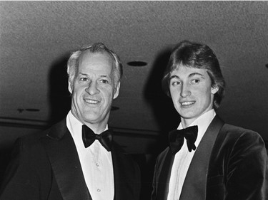 Gordie Howe (L) of the Hartford Whalers, and Wayne Gretzky of the Edmonton Oilers, pose for photographers at the NHL All-Star benefit dinner in Detroit, Feb. 5, 1980. The man known as Mr. Hockey has died. The Detroit Red Wings say Gordie Howe has died at age 88.