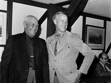 Gordie Howe stands with his father Abe Howe at the Olympia Room in a 1971 handout photo from the book "Mr. Hockey."