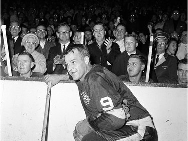 Detroit Red Wings' Gordie Howe acknowledges applause from the fans during a 20-minute standing ovation after he scored the 545th goal of his National Hockey League career at Detroit's Olympia Stadium, to set the leagues' all-time scoring mark, November 10, 1963.