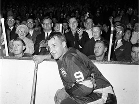 Gordie Howe acknowledges fans during a 20-minute ovation after he broke the NHL scoring record in 1963 with his 545th goal.