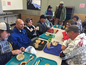 Participants in the homelessness education event put on by the Sanctum Care Group have breakfast.