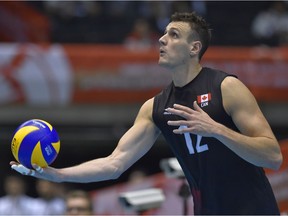 Gavin Schmitt of Canada serves the ball during the Men's World Olympic Qualification game between Poland and Canada at Tokyo Metropolitan Gymnasium on May 28, 2016 in Tokyo, Japan.