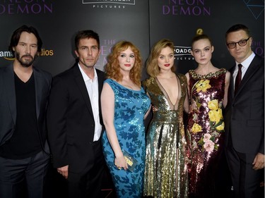 L-R: Actors Keanu Reeves, Alessandro Nivola, Christina Hendricks, Bella Heathcote, Elle Fanning and director Nicolas Winding Refn arrive at the premiere of Amazon's "The Neon Demon" at the Arclight Theatre on June 14, 2016 in Los Angeles, California.