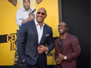 Actors Dwayne Johnson (L) and Kevin Hart attend the premiere of Warner Bros. Pictures' "Central Intelligence" at Westwood Village Theatre on June 10, 2016 in Westwood, California.