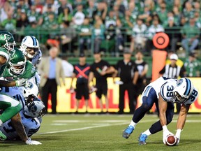 The Argonauts' Matt Black retrieves a Roughriders fumble before scoring from 27 yards away during first-half CFL action against the host Saskatchewan Roughriders on Thursday.