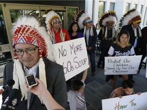 Saskatoon Tribal Council Chief Felix Thomas speaks to the media on June 28, 2016, outside Queen's Bench Court in Regina