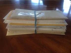 Ron Bodnar said he received this 40-letter stack of mail in his rural mailbox on May 18 - part of a six to eight month inconsistency in delivery.