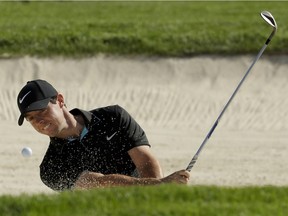 Rory McIlroy, of Northern Ireland, hits out of the bunker on the 13th hole during a practice round for the U.S. Open golf championship at Oakmont Country Club on Tuesday, June 14, 2016, in Oakmont, Pa.