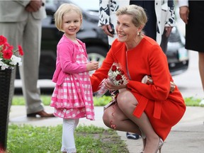 Three-year-old Lena Bradshaw smiles at royal supporters after giving flowers to Sophie, Countess of Wessex, during a visit to Deer Lodge Centre, a veterans hospital, in Winnipeg, Wednesday, June 22, 2016. Sophie and her husband Prince Edward, Earl of Wessex, spent the day in Winnipeg with local dignitaries and took part in such things as a tour of the Royal Aviation Museum of Western Canada and presiding over the Duke of Edinburgh Awards.