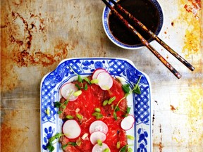 Beef carpaccio with radishes and ponzu sauce.