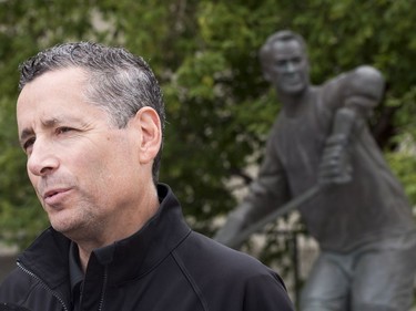 Saskatoon Blades president Steve Hogle speaks with media after visiting the Gordie Howe statue outside of Sasktel Centre in Saskatoon, June 10, 2016. Howe passed away today at the age of 88.