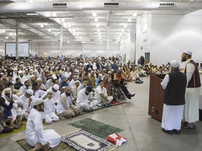 People listen to speakers during the Eid festival, which marks the end of Ramadan, the Islamic holy month of fasting, at Prairieland Park on Saturday, July 18th, 2015.