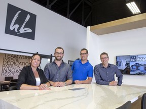 The owners of Haven Builders, l-r, Donna Senterre, Dustin Bueckert, Dallas Stobbe and Nathan Stobbe in their new downtown showroom.