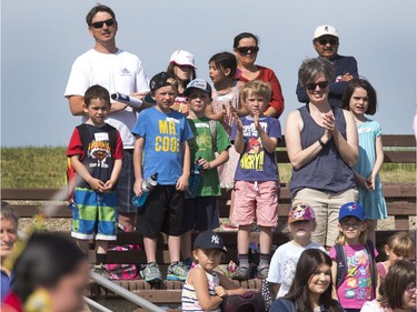 A large crowd applause the Indigenous dancers in the grand entry at the amphitheatre at Wanuskewin Heritage Park at the opening of the Aboriginal Day Celebration, June 21, 2016.