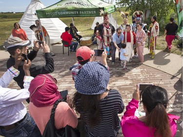 Photo with the indigenous dancers after the grand entry in the amphitheatre at Wanuskewin Heritage Park at the opening of the Aboriginal Day Celebration, June 21, 2016.