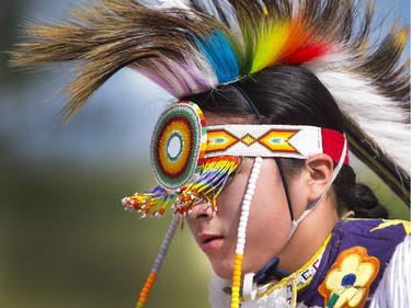 Indigenous dancer who goes by the name of Bluebird dances to the crowd at the grand entry in the amphitheatre at Wanuskewin Heritage Park at the opening of the Aboriginal Day Celebration, June 21, 2016.