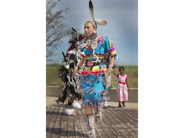 Visitors dance along with Indigenous dancers in the grand entry at the amphitheatre at Wanuskewin Heritage Park at the opening of the Aboriginal Day Celebration, June 21, 2016.