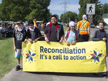 Thousands joined the "Rock Your Roots" Walk for Reconciliation at a Day of Reconciliation in Saskatoon, June 22, 2016. The walk began at Victoria Park and went past the 1812 statue, the Gabriel Dumont statue and the Chief Whitecap and John Lake statue before going through River Landing and finishing at the park along the Meewasin Trail.