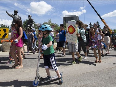 Thousands joined the "Rock Your Roots" Walk for Reconciliation at a Day of Reconciliation in Saskatoon, June 22, 2016. The walk began at Victoria Park and went past the 1812 statue, the Gabriel Dumont statue and the Chief Whitecap and John Lake statue before going through River Landing and finishing at the park along the Meewasin Trail.