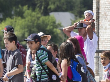 Thousands joined the "Rock Your Roots" Walk for Reconciliation at a Day of Reconciliation in Saskatoon, June 22, 2016. The walk began at Victoria Park and went past the 1812 statue, the Gabriel Dumont statue and the Chief Whitecap and John Lake statue before going through River Landing and finishing at the park along the Meewasin Trail.