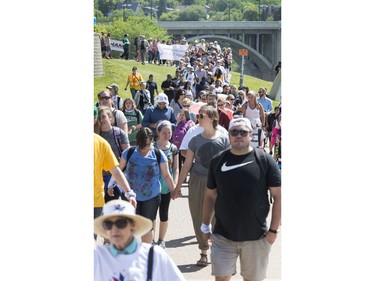 Thousands joined the "Rock Your Roots" Walk for Reconciliation at a Day of Reconciliation in Saskatoon, June 22, 2016. The walk began at Victoria Park and went past the 1812 statue, the Gabriel Dumont statue and the Chief Whitecap and John Lake statue before going through River Landing and finishing at the park along the Meewasin Trail.