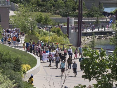 Thousands joined the "Rock Your Roots" Walk for Reconciliation at a Day of Reconciliation in Saskatoon, June 22, 2016. The walk began at Victoria Park and went past the 1812 statue, the Gabriel Dumont statue and the Chief Whitecap and John Lake statue before going through River Landing and finishing at the park along the Meewasin Trail.