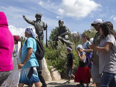 Thousands joined the "Rock Your Roots" Walk for Reconciliation at a Day of Reconciliation in Saskatoon, June 22, 2016. The walk began at Victoria Park and went past the 1812 statue, the Gabriel Dumont statue and the Chief Whitecap and John Lake statue before going through River Landing and finishing at the park along the Meewasin Trail.