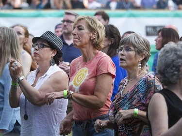 Fans listen as Jesse Cook and his band play at the 30th annual SaskTel Saskatchewan Jazz Festival in Bessborough Gardens, June 27, 2016.