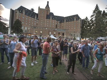 Fans listen as Jesse Cook and his band play at the 30th annual SaskTel Saskatchewan Jazz Festival in Bessborough Gardens, June 27, 2016.