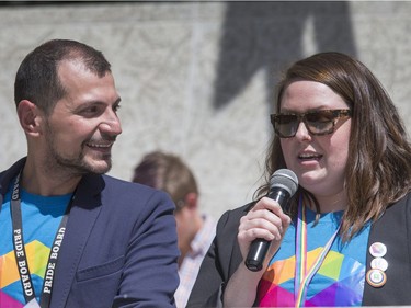 Pride Week board organizers Danny Papadatos and Krystal Nieckar address the large crowd that attended the Pride Week flag raising at City Hall in Saskatoon, June 6, 2016