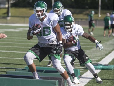 Fullback Spencer Moore (80) leads a drill during Saskatchewan Roughriders training camp in Saskatoon, June 6, 2016.