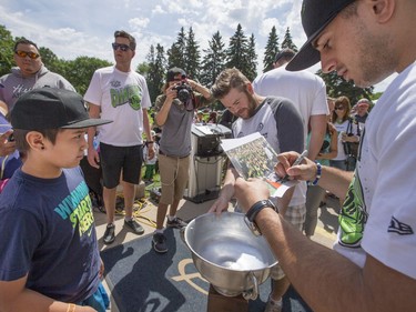 Pictures with Rush players along with autographs for a cheering crowd at a champions rally for NLL Champions the Saskatchewan Rush in Bessborough Gardens, June 7, 2016.