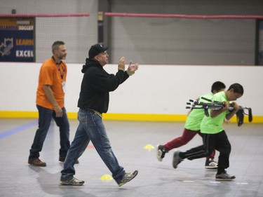 Garth Brooks cheers on participants of a team competition during the Saskatoon Teammates Procamp in Saskatoon, June 11, 2016.