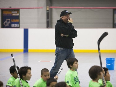 Garth Brooks cheers on participants of a team building exercise during the Saskatoon Teammates Procamp in Saskatoon, June 11, 2016.