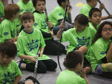 Kids practice hockey drills during the Saskatoon Teammates Procamp in Saskatoon, June 11, 2016.