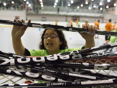 Kids practice hockey drills during the Saskatoon Teammates Procamp in Saskatoon, June 11, 2016.