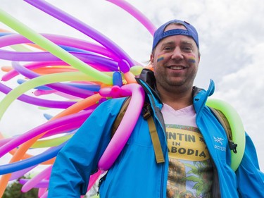 Dr. John Dosman from the Saskatoon Community Clinic prepares to march in the Saskatoon Pride Parade, June 11, 2016.