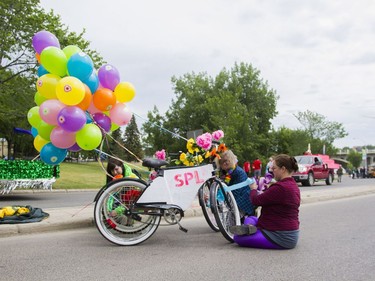 L-R: Sarah Morden, Heather Clark and Shannon Mason prepare their float before the Saskatoon Pride Parade, June 11, 2016.