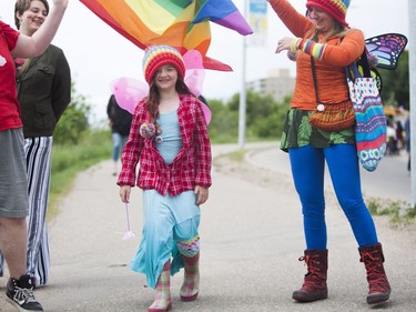 Olive Forrest walks past all of the floats before the Saskatoon Pride Parade, June 11, 2016.