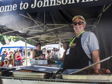 Dennis Taylor cooks food for patrons at his booth at the PotashCorp Saskatchewan Children's Festival in Kiwanis Park in Saskatoon, June 4, 2016.