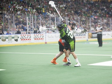 Saskatchewan Rush #22 Jarrett Davis comes in contact with a Buffalo Bandits player during the NLL Championship game at SaskTel Centre in Saskatoon, June 4, 2016.