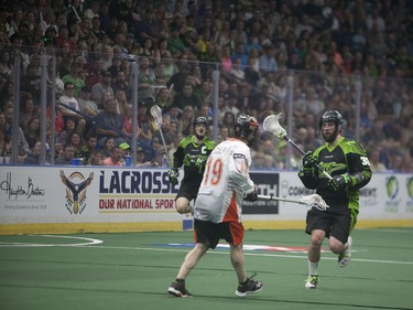 Saskatchewan Rush's John LaFontaine moves past Buffalo Bandits #19 Chad Culp during the NLL Championship game at SaskTel Centre in Saskatoon, June 4, 2016.