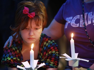 Community members come together at the candlelight vigil for the 50 lives lost during the Orlando shooting at Saskatoon's City Hall on Sunday night, June 12, 2016.