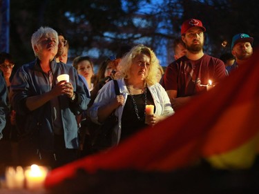 Community members come together at the candlelight vigil for the 50 lives lost during the Orlando shooting at Saskatoon's City Hall on Sunday night, June 12, 2016.