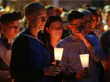 Yolanda Verhoef and Aiden Aichele hug each other after the candlelight vigil for the 50 lives lost during the Orlando shooting at Saskatoon's City Hall on Sunday night, June 12, 2016.