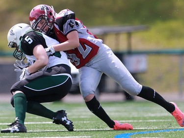 Riot's Mira Trebilcock tackles Valkyries' Stacey Boldt during first half action at the Saskatoon Valkyries vs. Regina Riot conference final at SMF Field in Saskatoon, June 19, 2016.