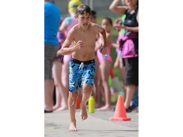 Tomas Wiersma competes in the Kids of Steel Triathlon at Riversdale Pool and Victoria Park in Saskatoon on June 19, 2016.