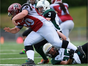 Valkyries' Danielle Haughian takes down Riot's Carly Kentz during first half action at the Saskatoon Valkyries vs. Regina Riot conference final at SMF Field in Saskatoon, June 19, 2016.